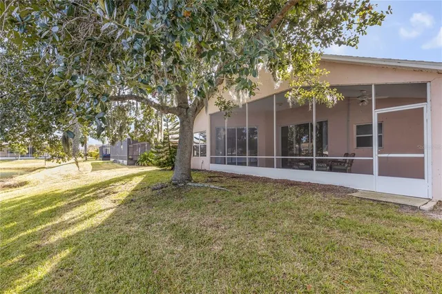 a view of a chairs and table in patio