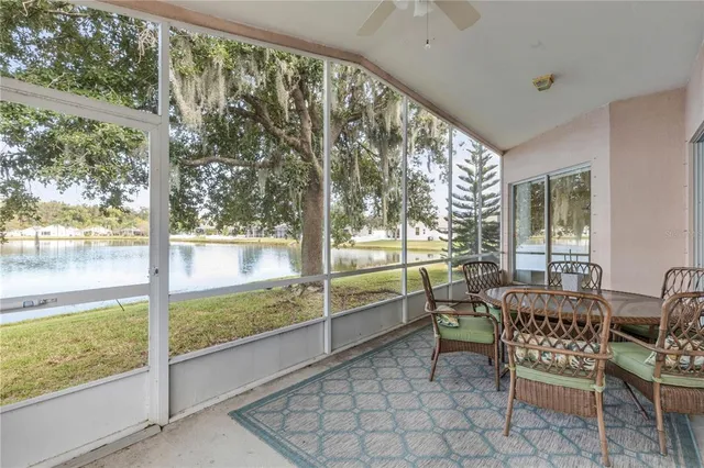 a view of a lake with houses in the back