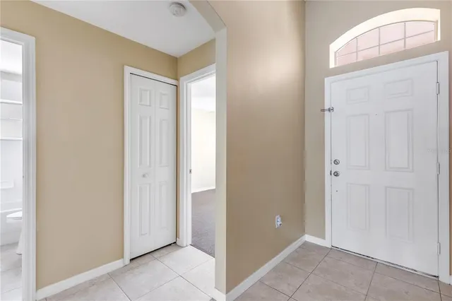 a view of a hallway to rooms