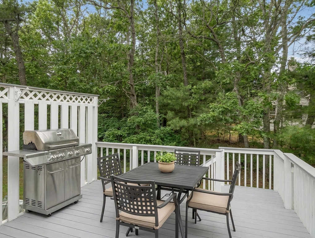 10 Kettle Lane, Unit 10 Mashpee, MA 02649 - Photo 25 of 25 a view of a chair and table on the deck