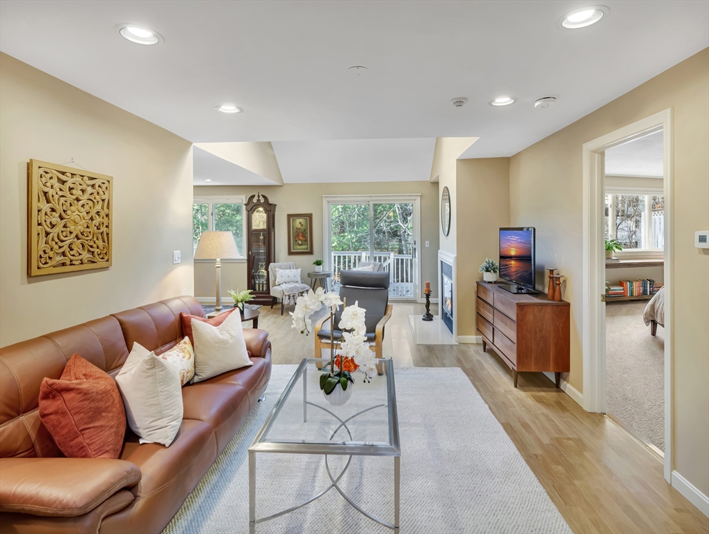 10 Kettle Lane, Unit 10 Mashpee, MA 02649 - Photo 3 of 25 a living room with furniture and a large window