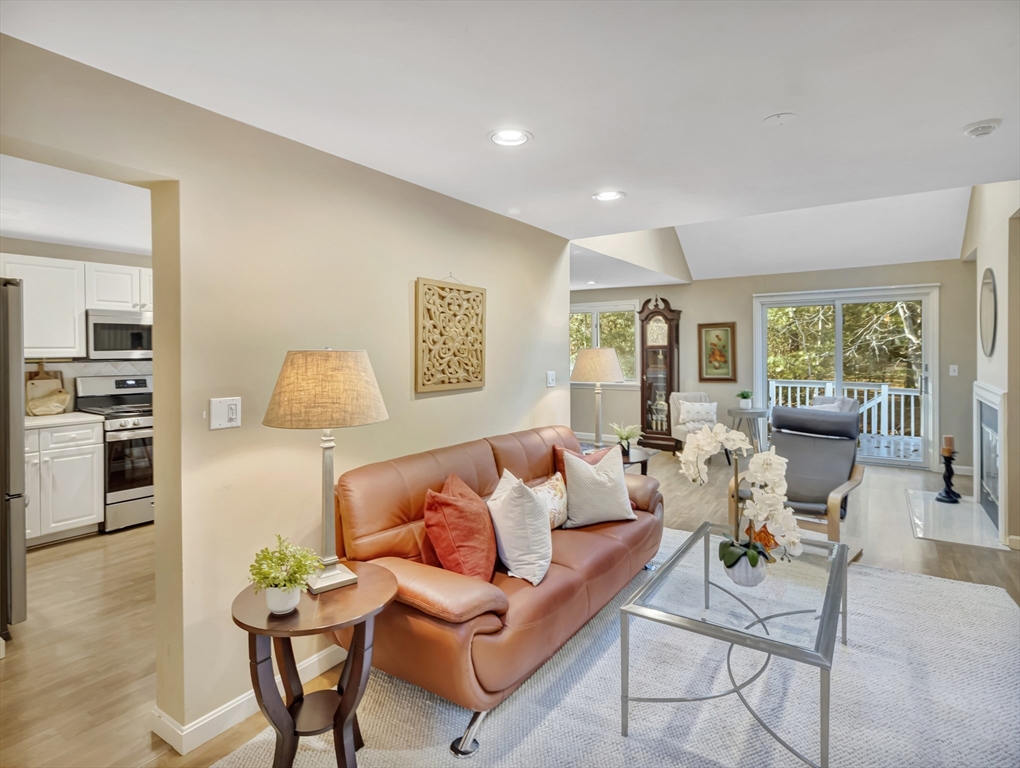 10 Kettle Lane, Unit 10 Mashpee, MA 02649 - Photo 5 of 25 a living room with furniture and a large window