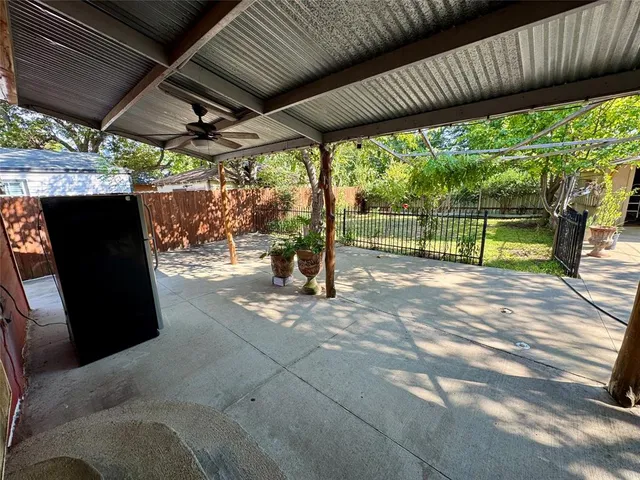 a view of outdoor space with wooden floor