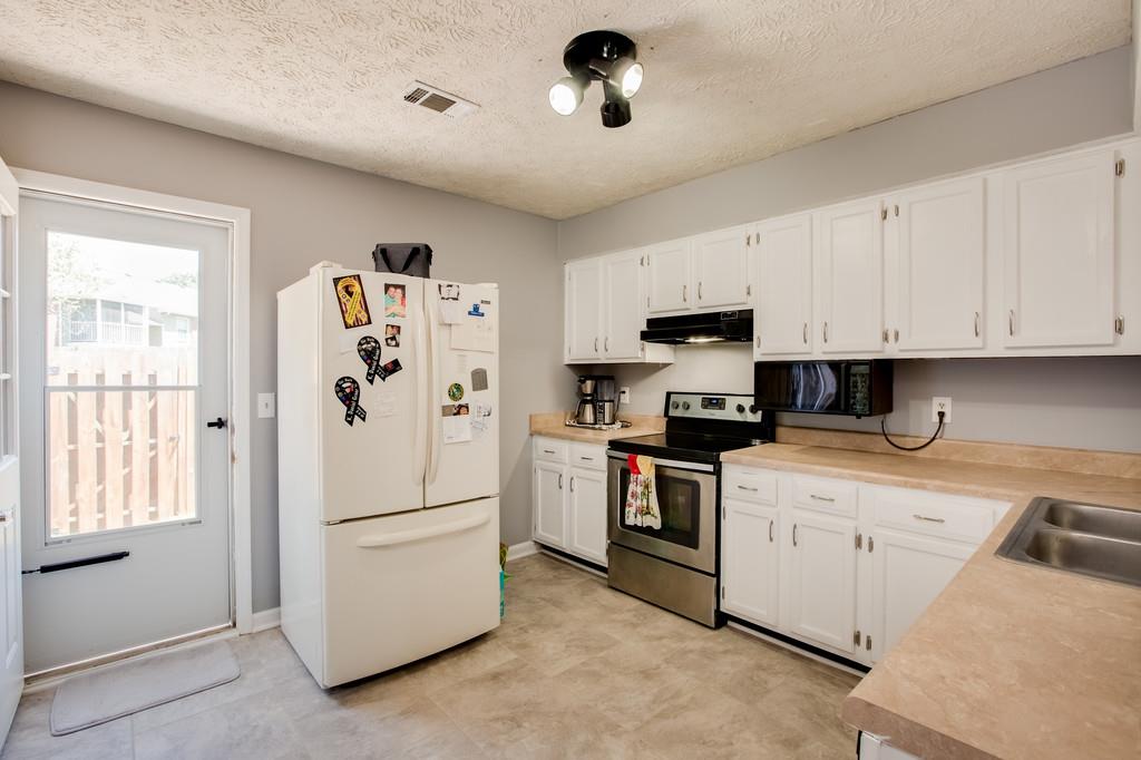 430 Walton Ferry Road, Unit 200 Hendersonville, TN 37075 - Photo 8 of 28 a kitchen with a refrigerator stove and sink