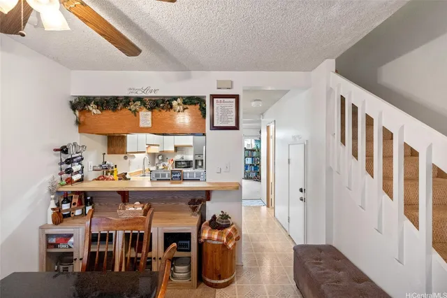 a dining room with furniture and a window