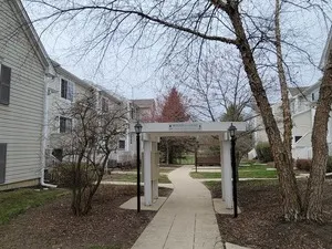 a view of a building with a yard
