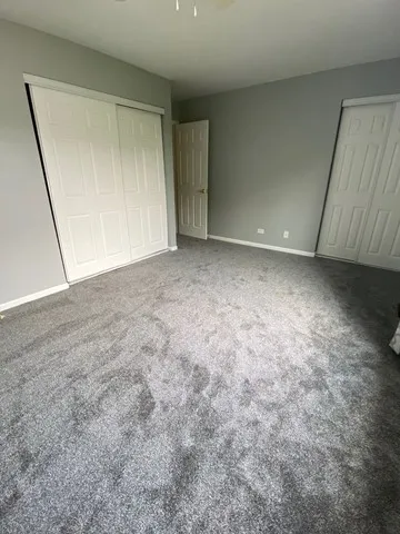 a view of an empty room and a window