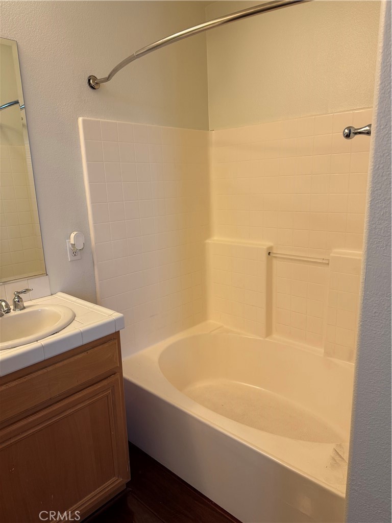 12268 Chantrelle Drive Rancho Cucamonga, CA 91739 - Photo 11 of 12 a bathroom with a sink and a bathtub