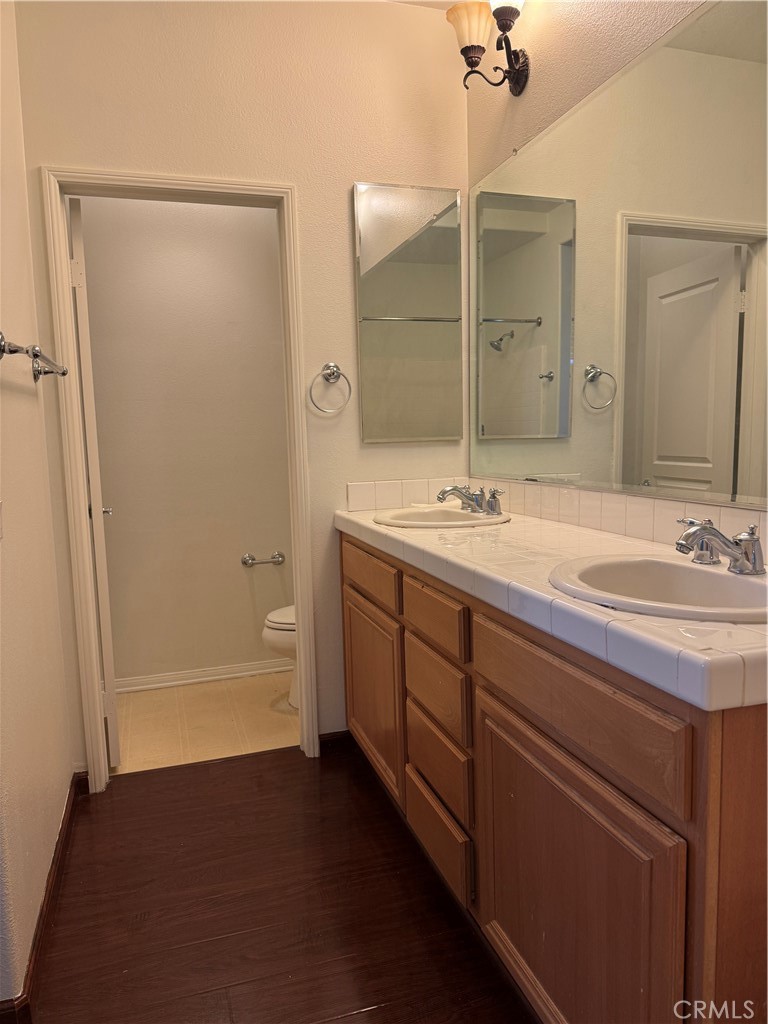 12268 Chantrelle Drive Rancho Cucamonga, CA 91739 - Photo 12 of 12 a bathroom with a sink and a mirror
