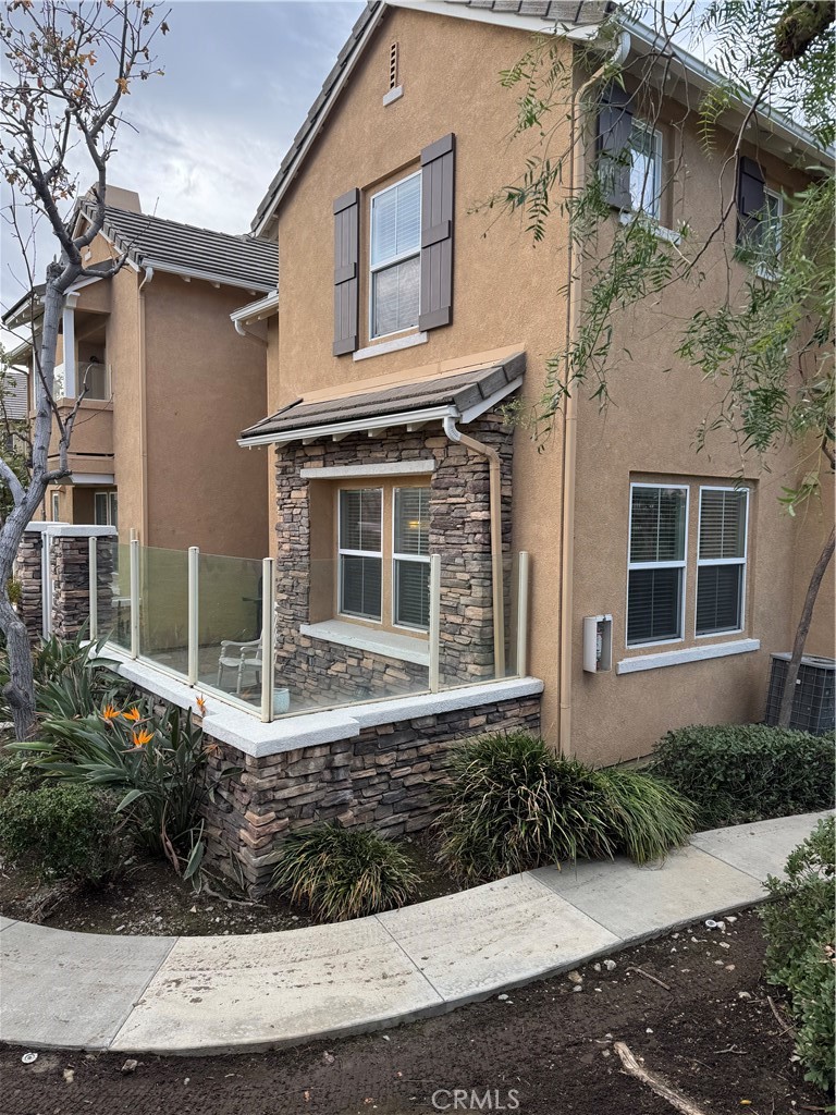 12268 Chantrelle Drive Rancho Cucamonga, CA 91739 - Photo 2 of 12 a front view of a house with garden
