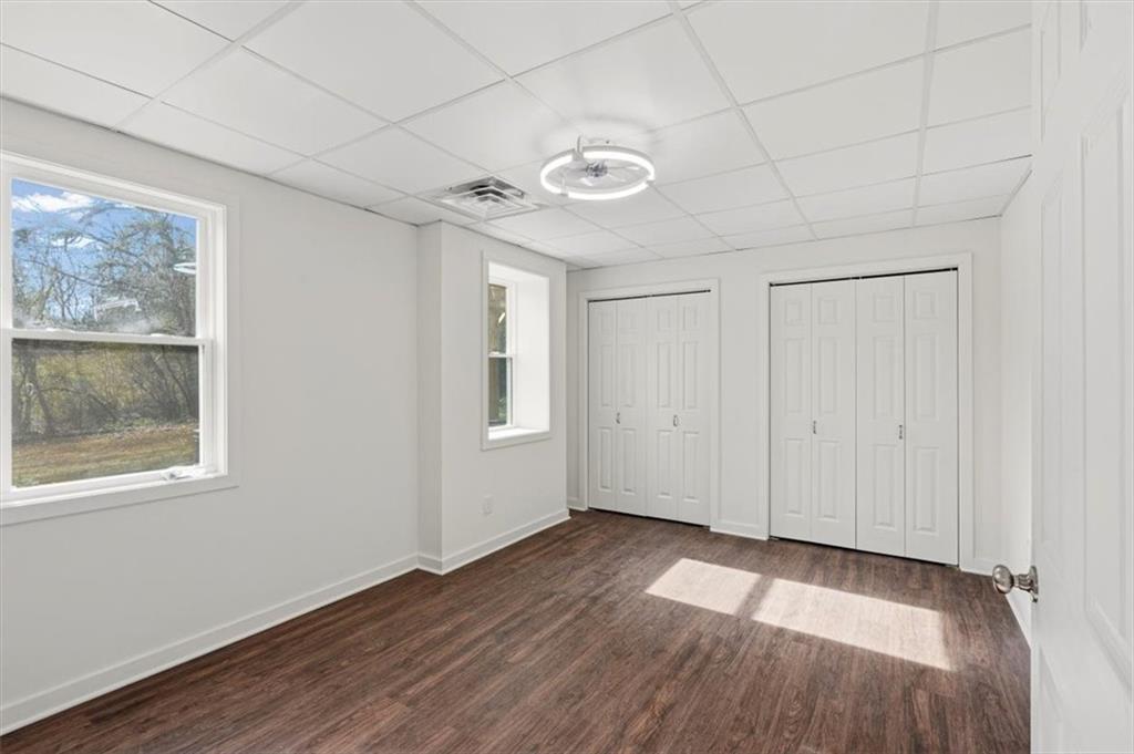 49 Apache Trail Cartersville, GA 30120 - Photo 37 of 52 a view of an empty room with a window and wooden floor