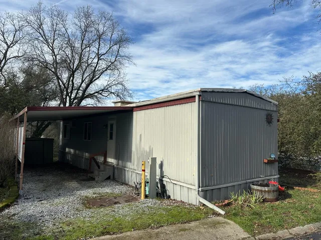 a house with trees in the background