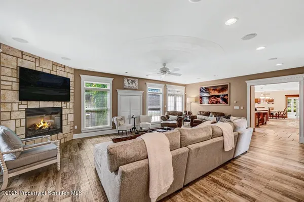 a living room with fireplace furniture and a fireplace