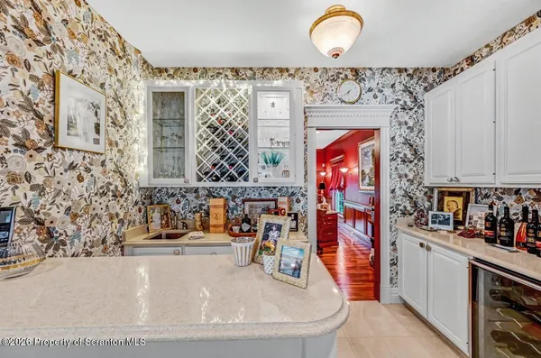 a large kitchen with stainless steel appliances granite countertop a stove and more cabinets
