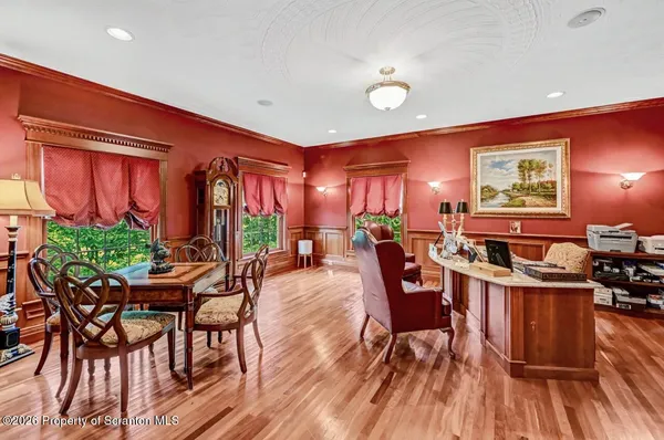 a kitchen with stainless steel appliances a stove a sink dishwasher and cabinets with wooden floor
