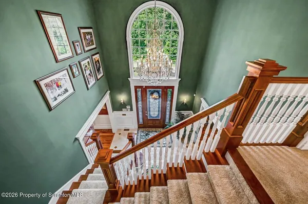 a kitchen with stainless steel appliances granite countertop a sink a stove and a microwave