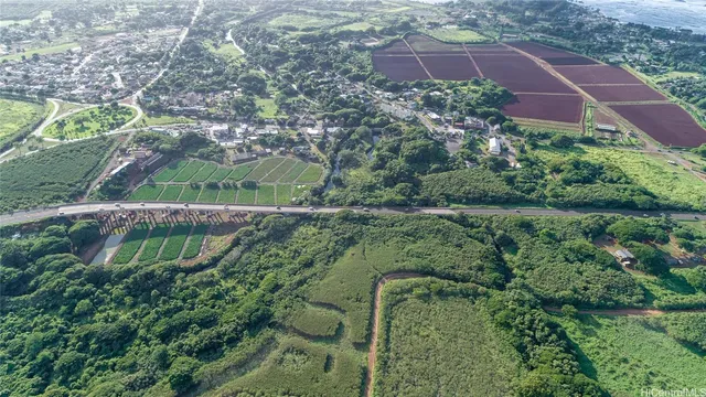 an aerial view of a house with a yard