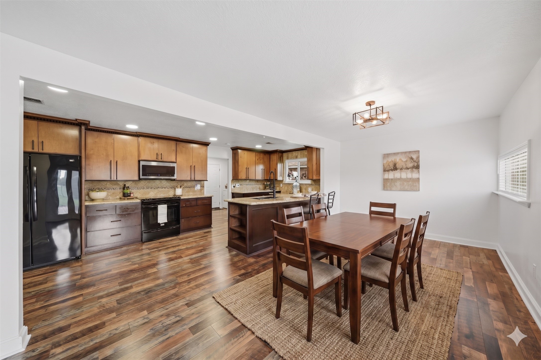79 Summers Wind Street Conroe, TX 77356 - Photo 9 of 45 a view of a dining room with furniture and a kitchen