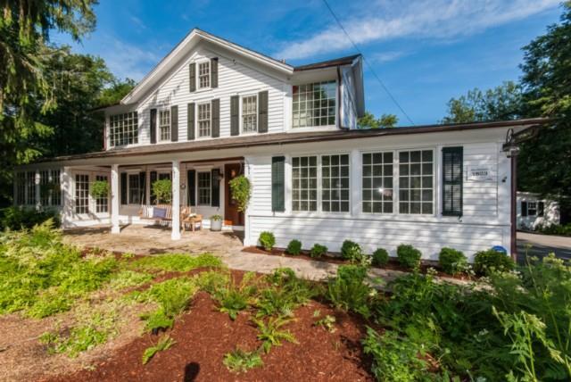 100 Partrick Road Westport, CT 06880 - Photo 1 of 1 a front view of a house with a yard and porch