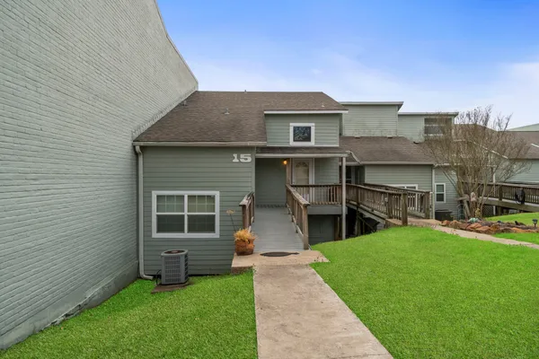 a front view of house with yard and outdoor seating
