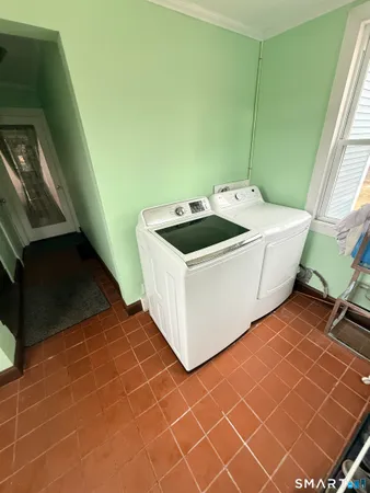 a utility room with a sink a washer and dryer