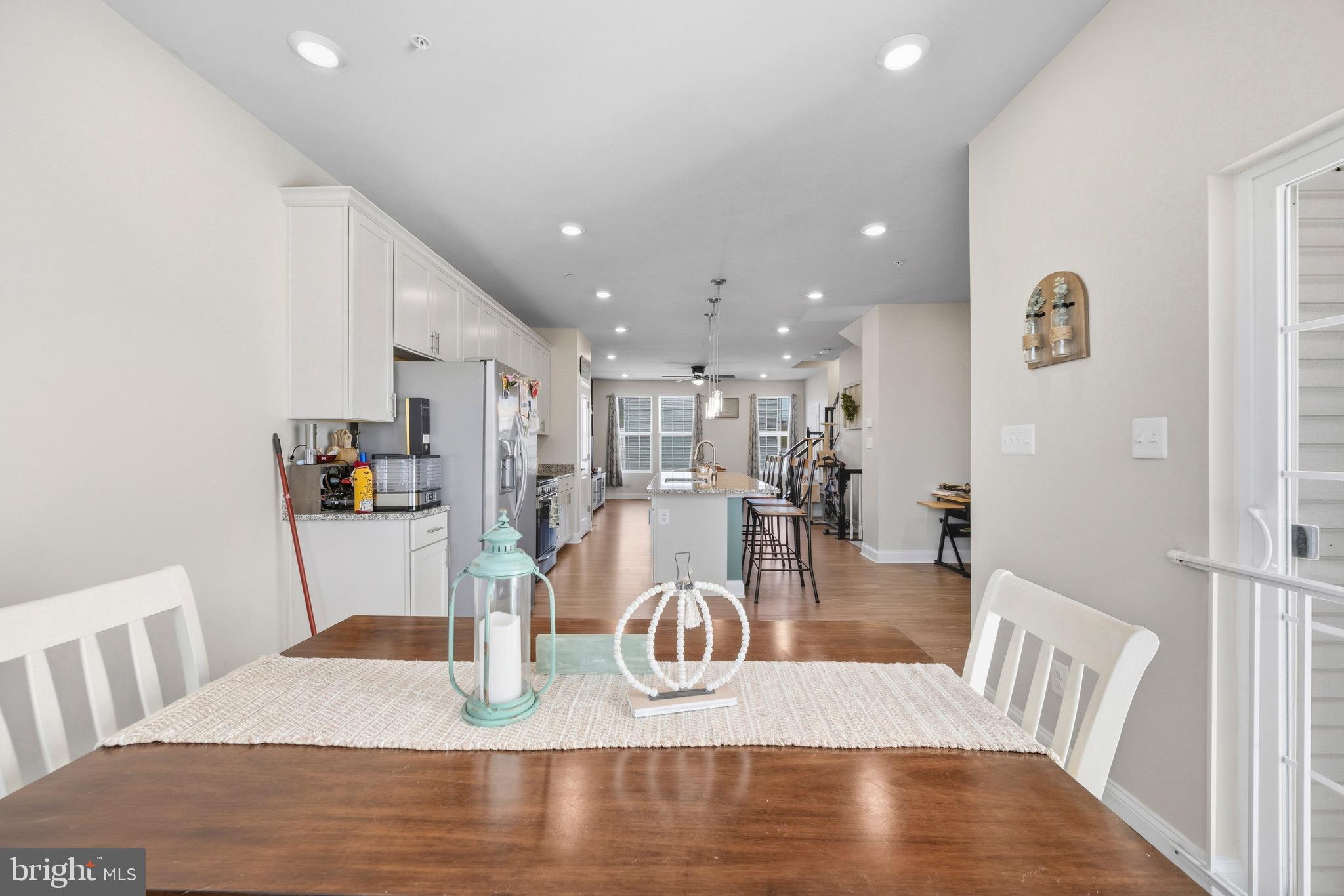 403 Dryden Road Aberdeen, MD 21001 - Photo 11 of 44 a view of a dining room with furniture a chandelier and wooden floor