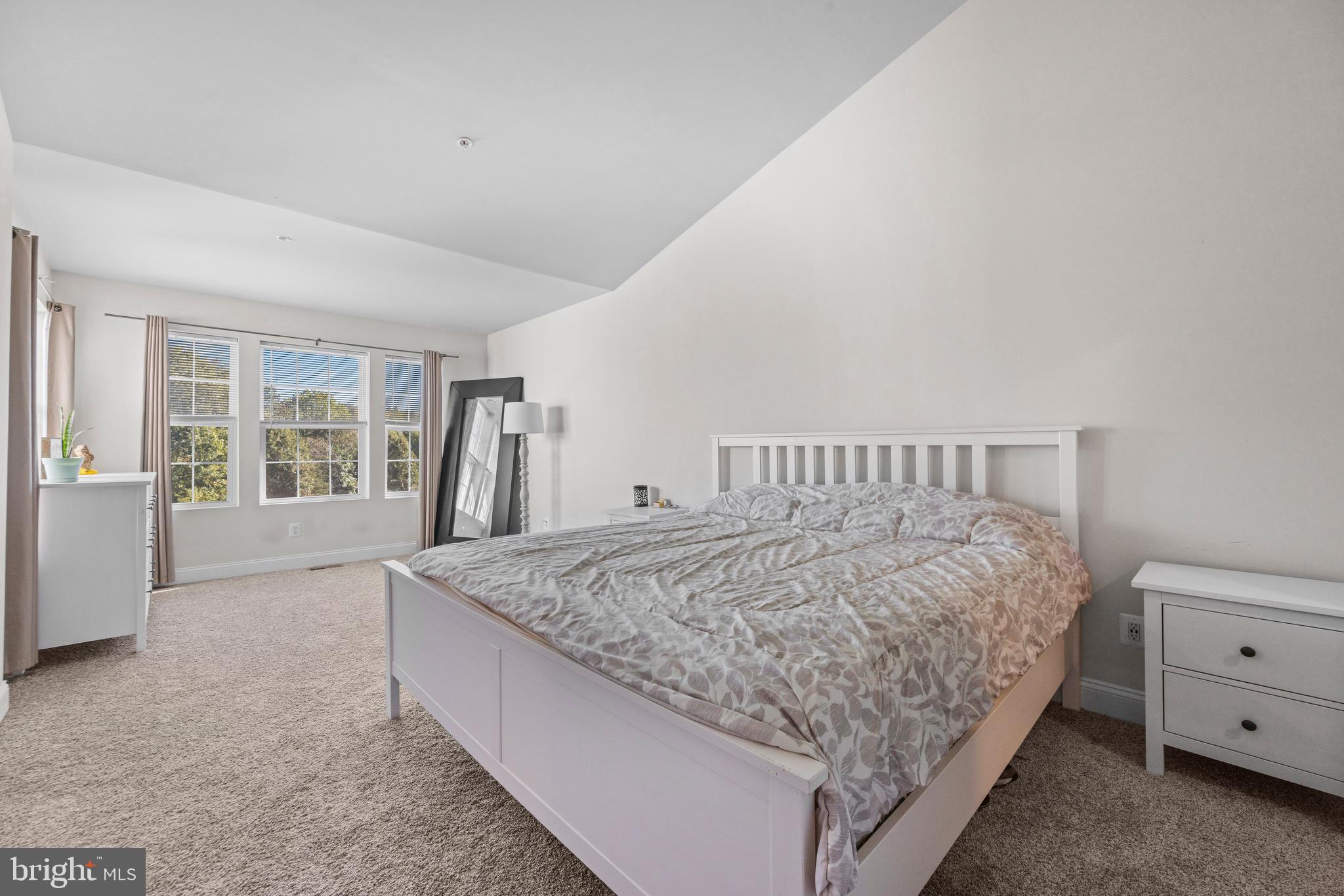 403 Dryden Road Aberdeen, MD 21001 - Photo 12 of 44 a bed sitting in a bedroom next to a window