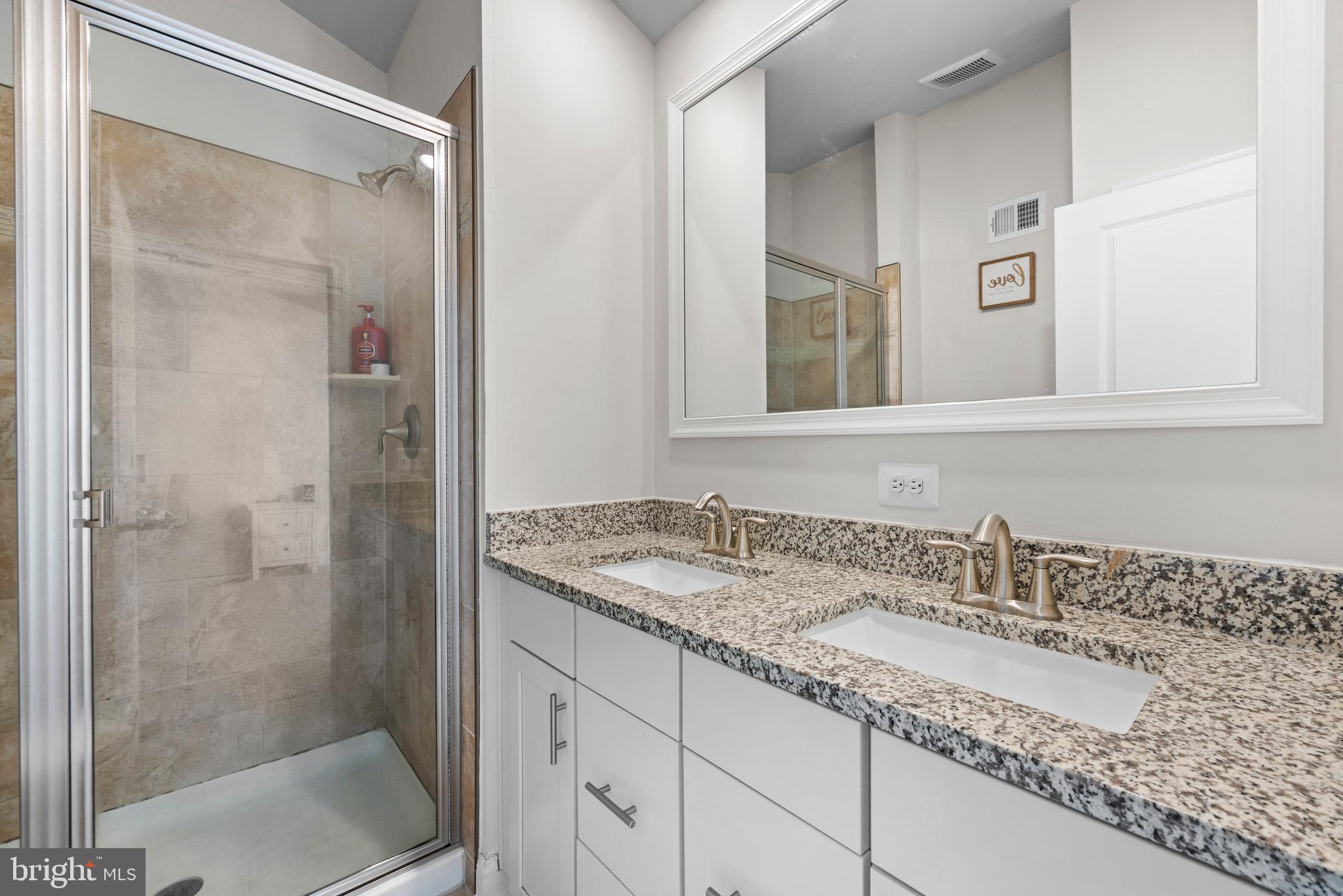403 Dryden Road Aberdeen, MD 21001 - Photo 14 of 44 a bathroom with a granite countertop sink and a mirror