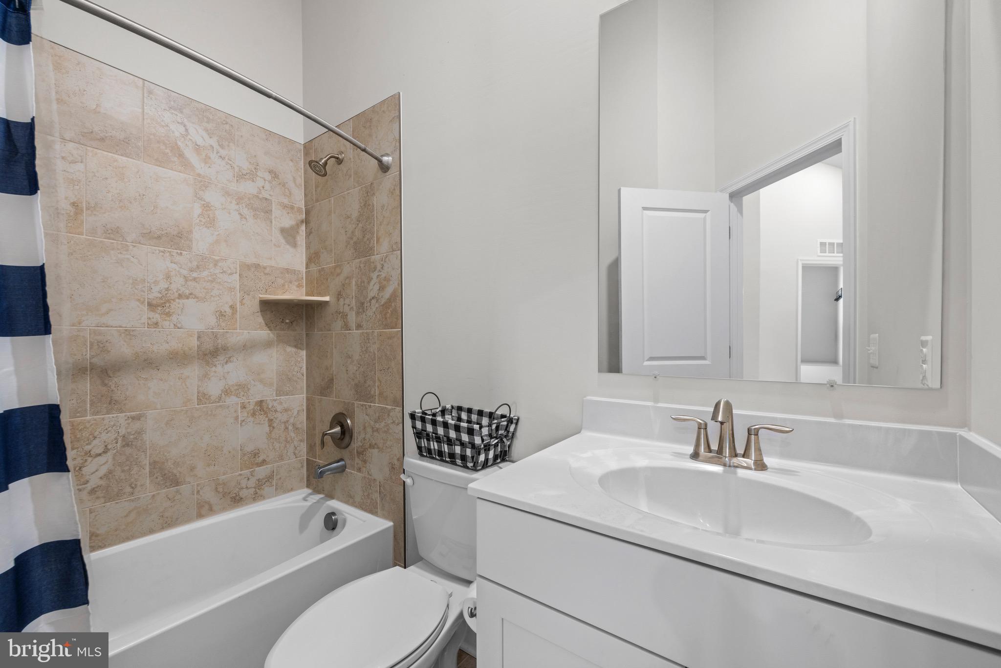 403 Dryden Road Aberdeen, MD 21001 - Photo 19 of 44 a bathroom with a sink toilet and shower