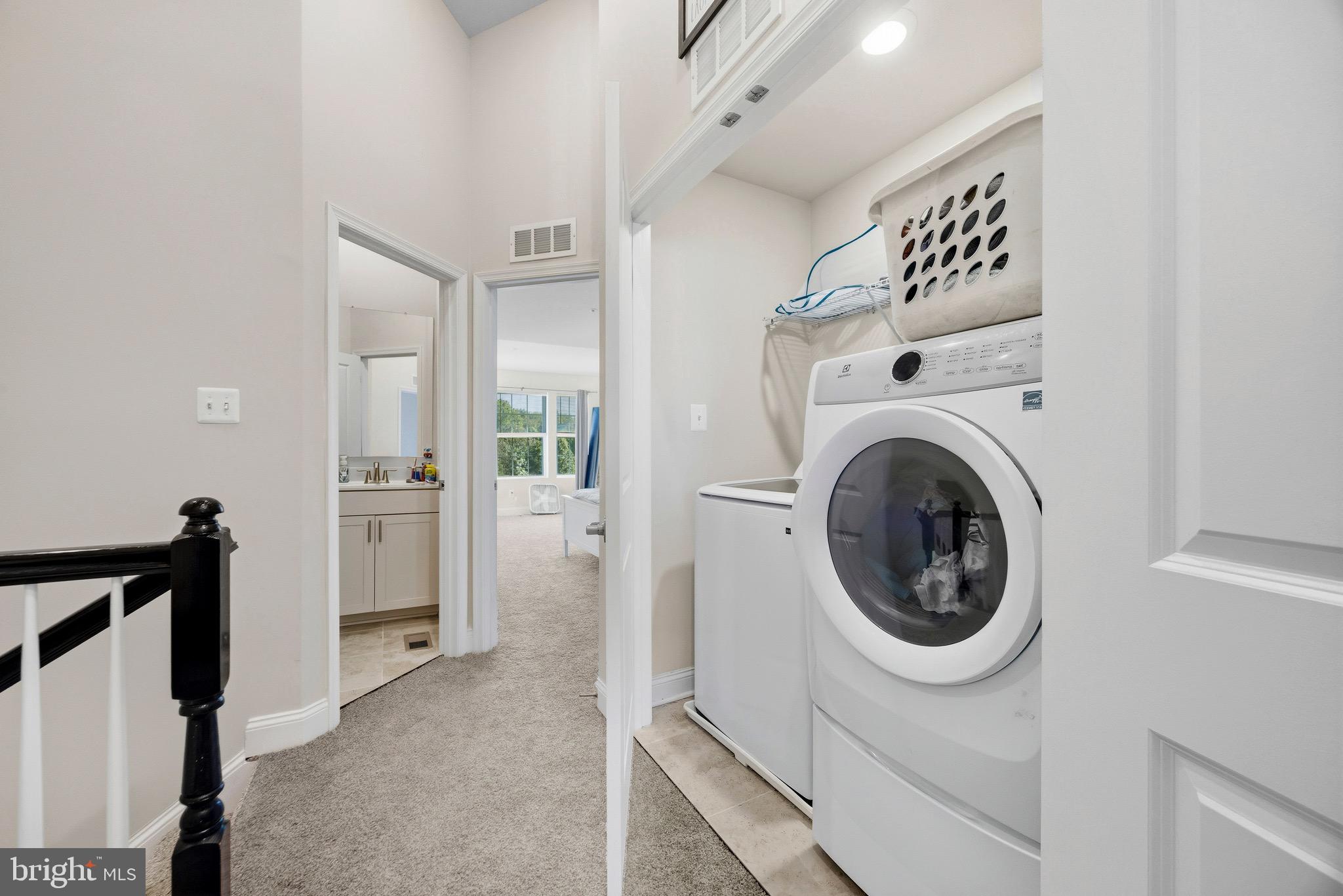 403 Dryden Road Aberdeen, MD 21001 - Photo 20 of 44 a view of a hallway with washer and dryer