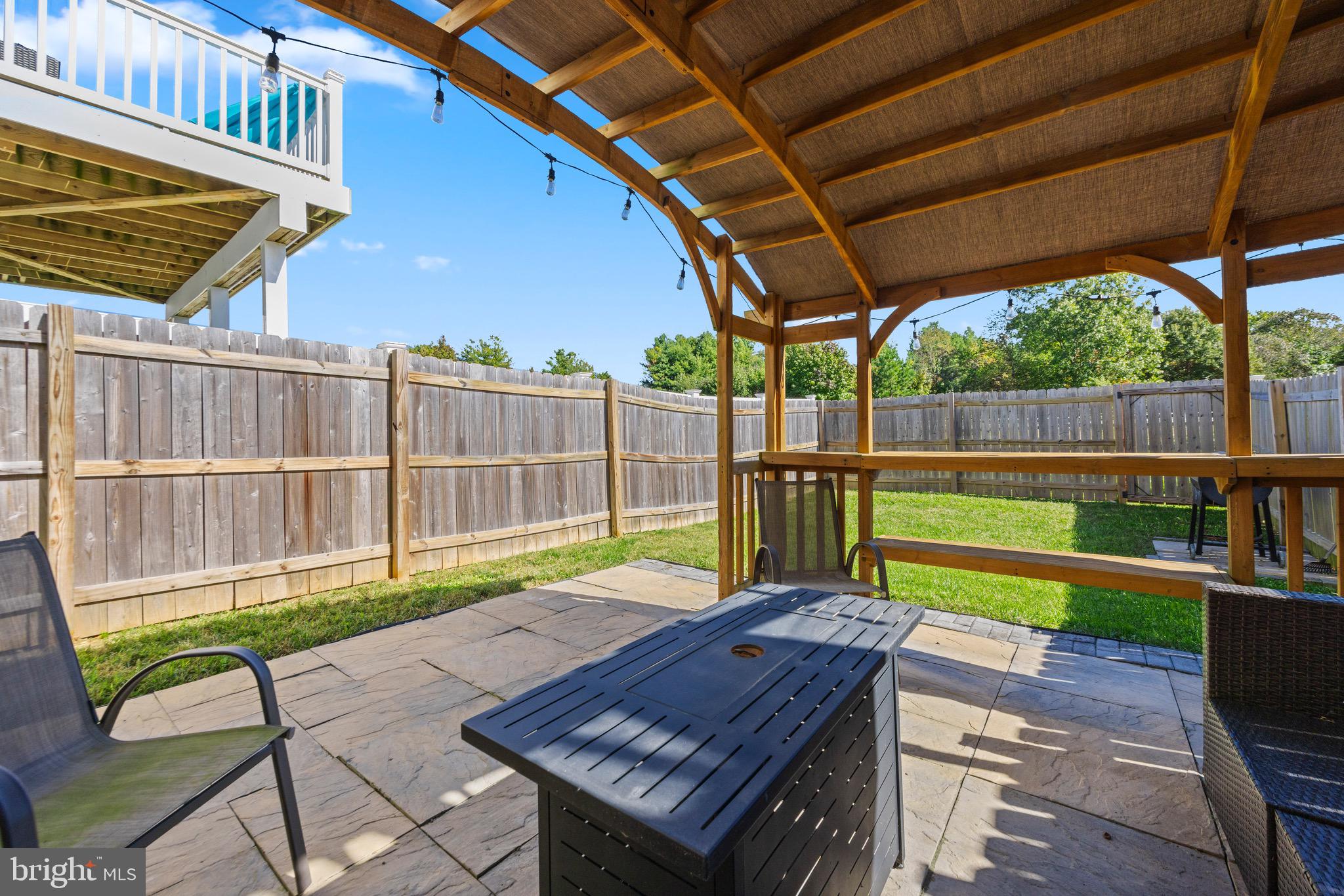 403 Dryden Road Aberdeen, MD 21001 - Photo 27 of 44 a view of a backyard with a wooden deck and furniture