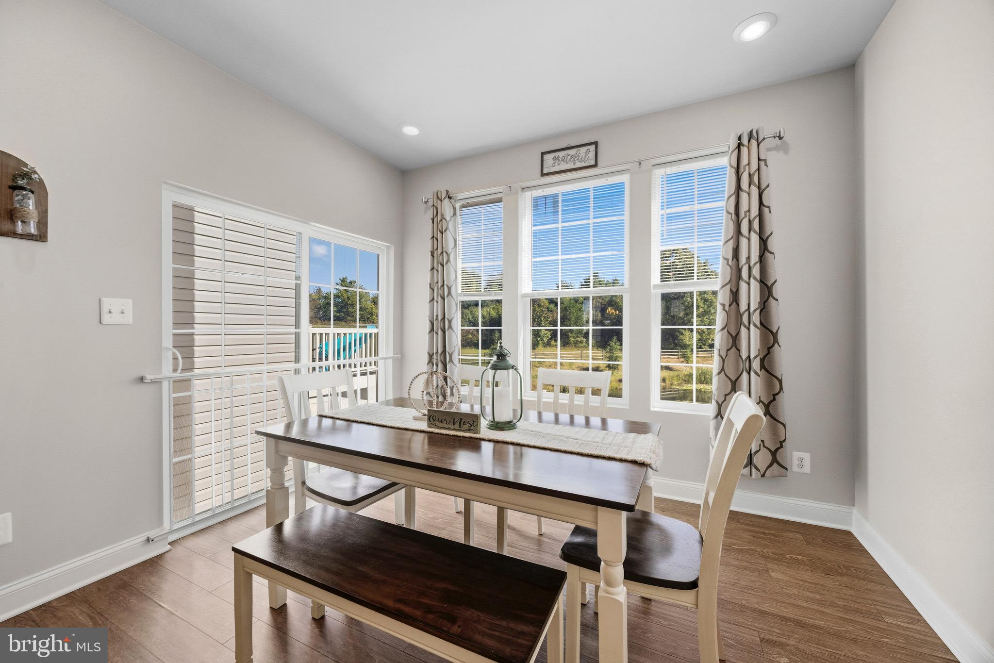 403 Dryden Road Aberdeen, MD 21001 - Photo 10 of 44 a dining room with furniture and wooden floor