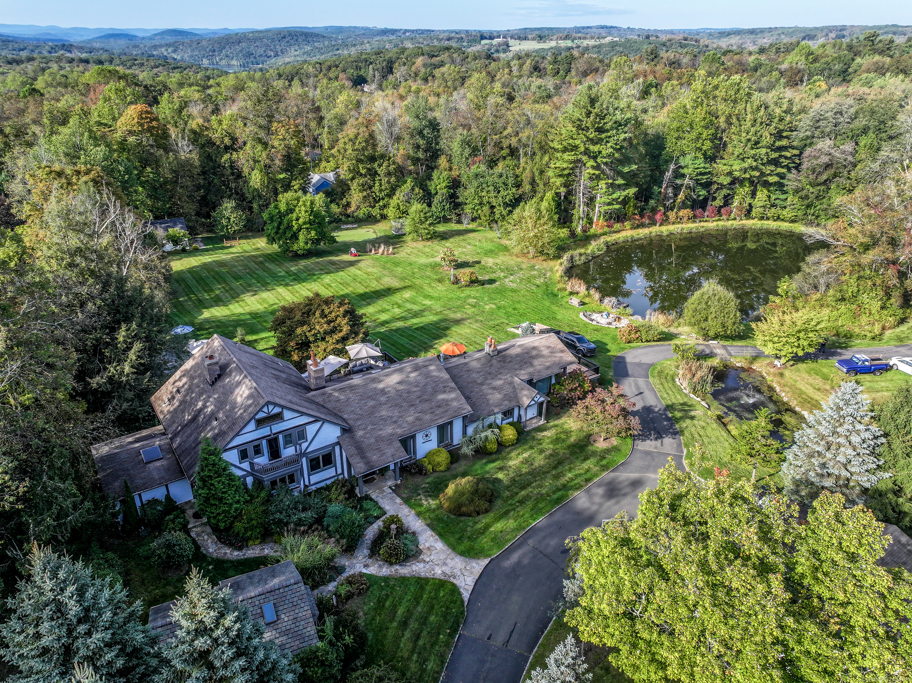 an aerial view of a house with a yard