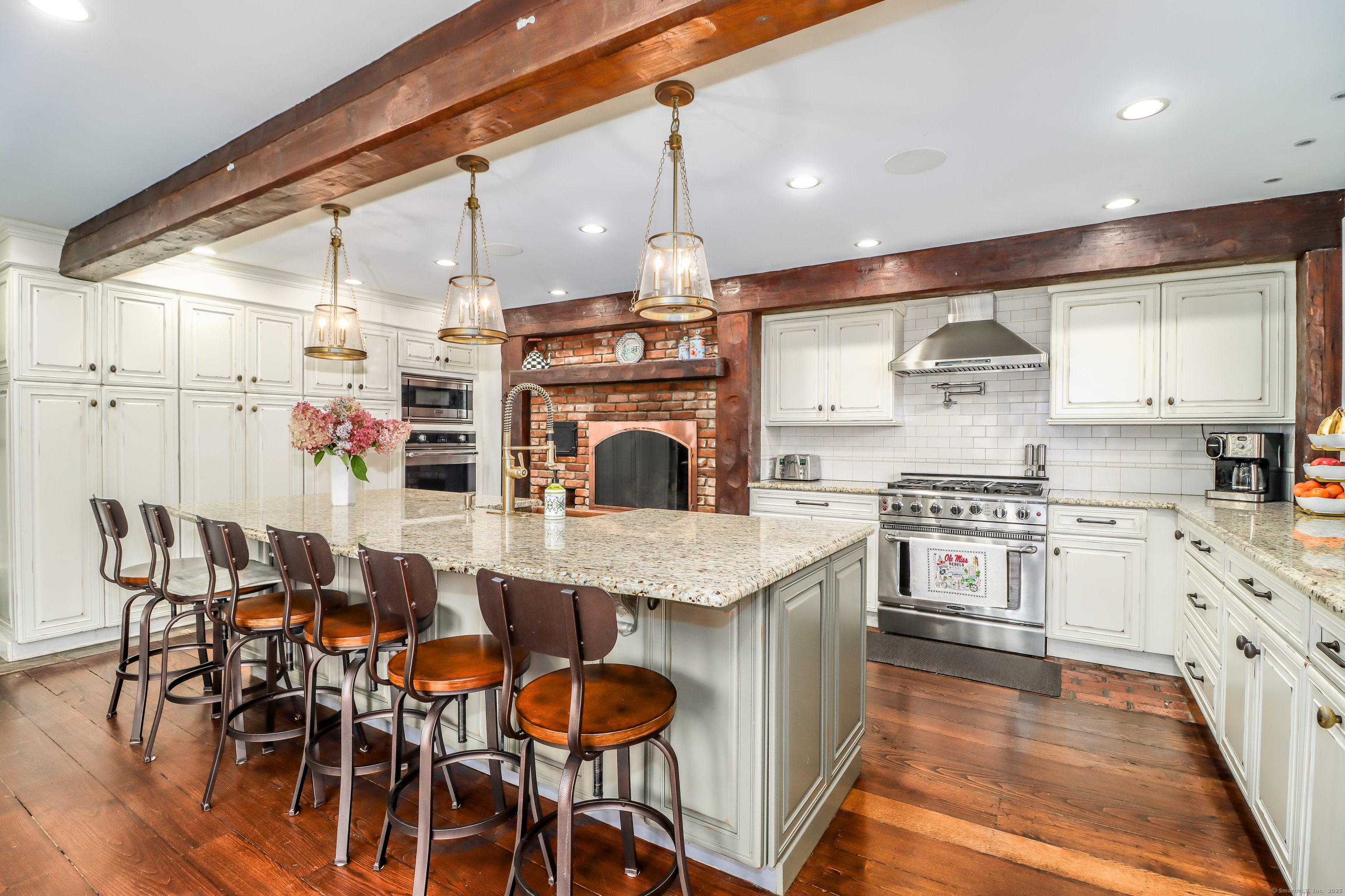 70 Obtuse Hill Road Brookfield, CT 06804 - Photo 15 of 37 a kitchen with stainless steel appliances granite countertop a kitchen island a stove and a wooden floors