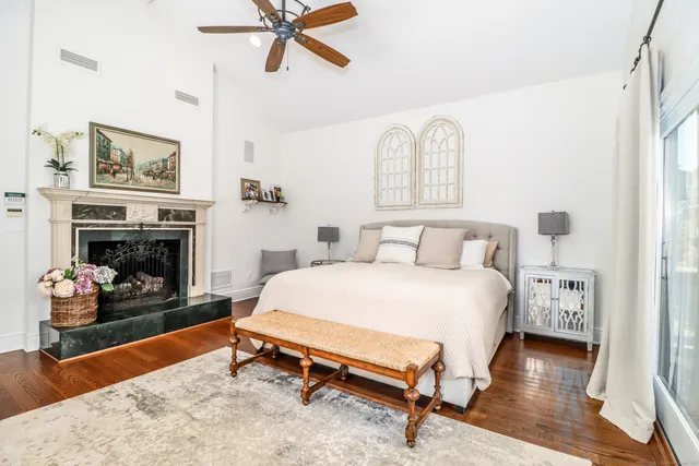 a bedroom with a bed and a fireplace