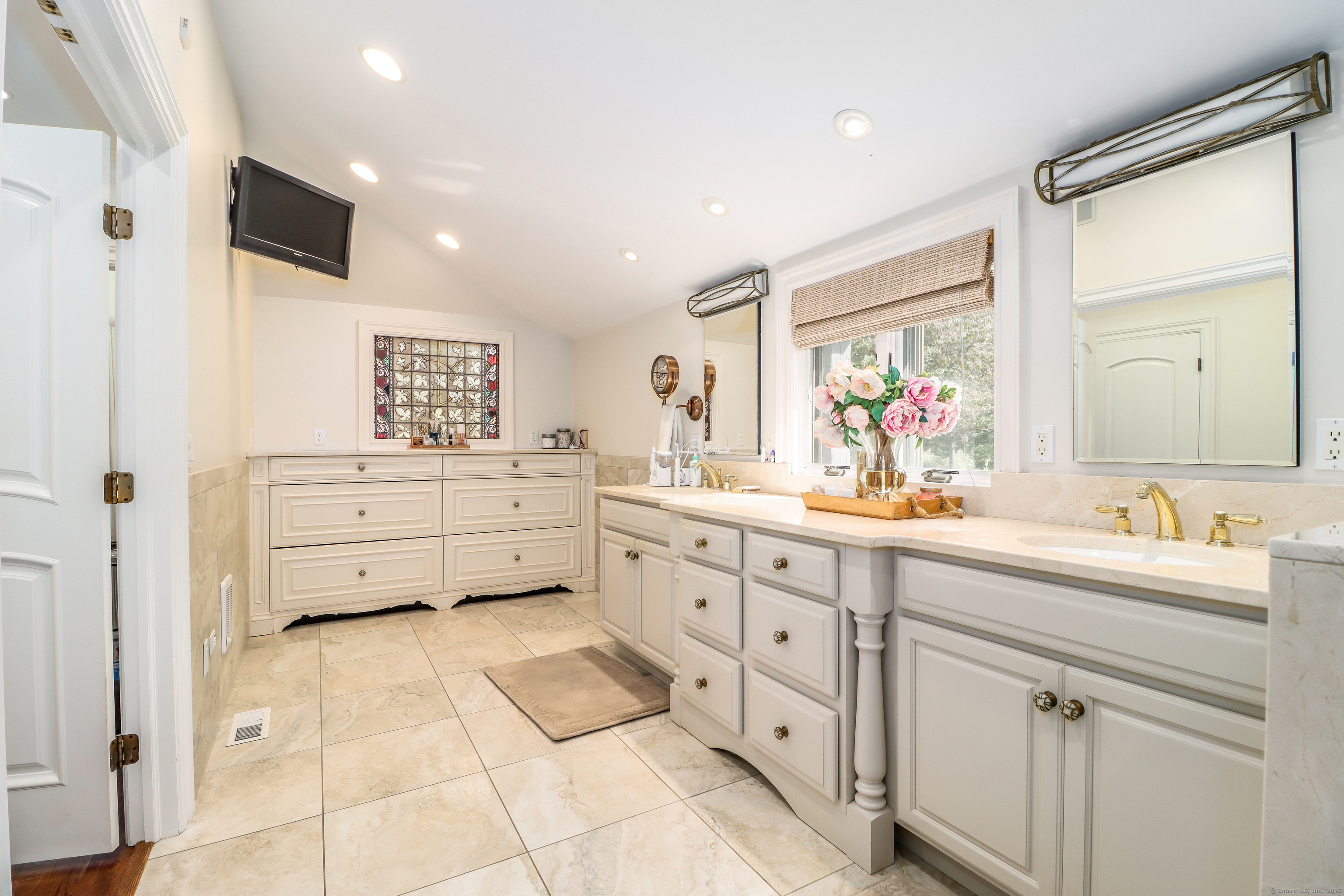 70 Obtuse Hill Road Brookfield, CT 06804 - Photo 18 of 37 a spacious bathroom with a double vanity sink mirror and toilet