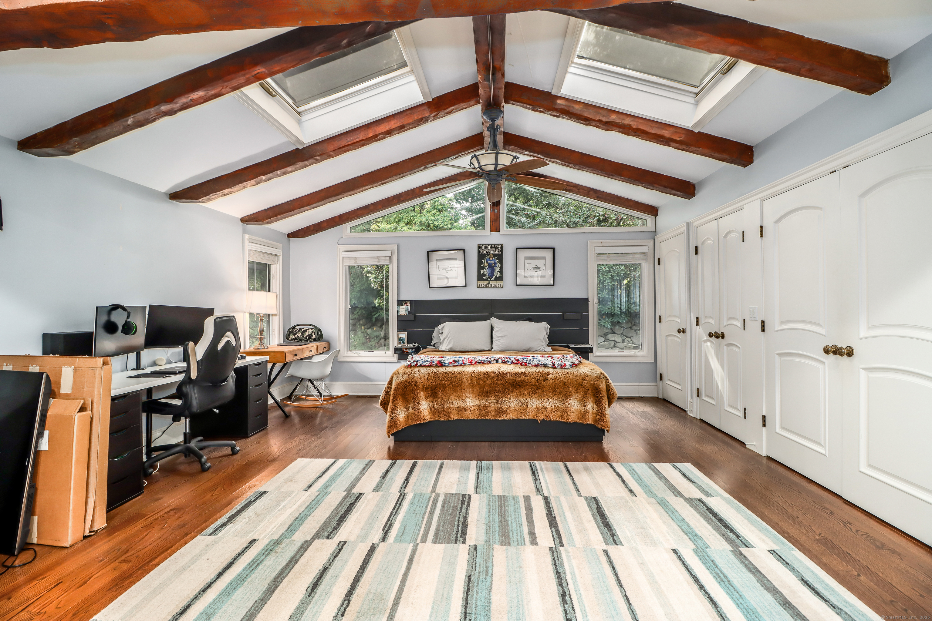 70 Obtuse Hill Road Brookfield, CT 06804 - Photo 19 of 37 a bed sitting in a bedroom next to a window