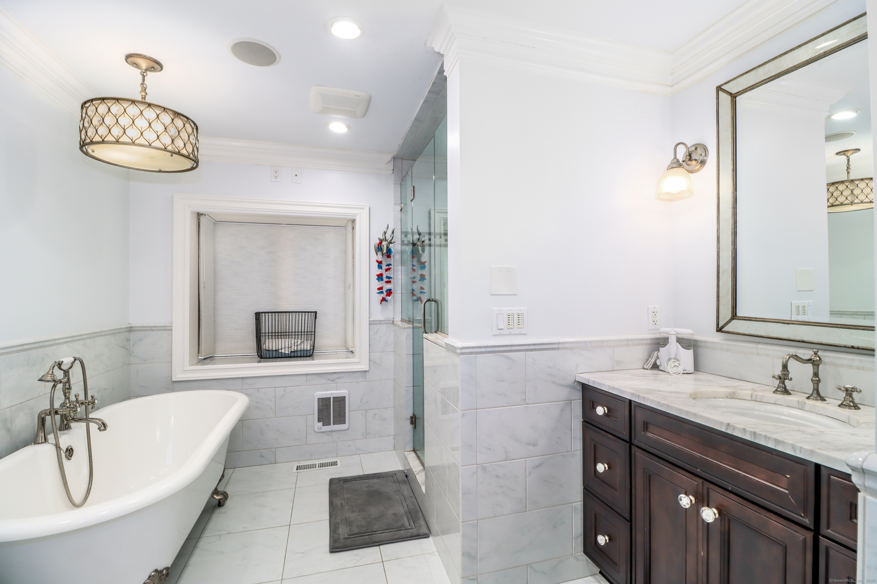 70 Obtuse Hill Road Brookfield, CT 06804 - Photo 20 of 37 a bathroom with a sink a tub and a mirror