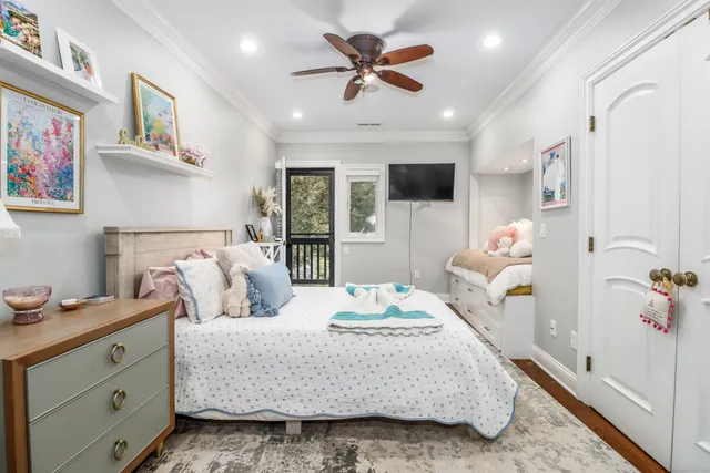 a bedroom with a bed a window and a couch