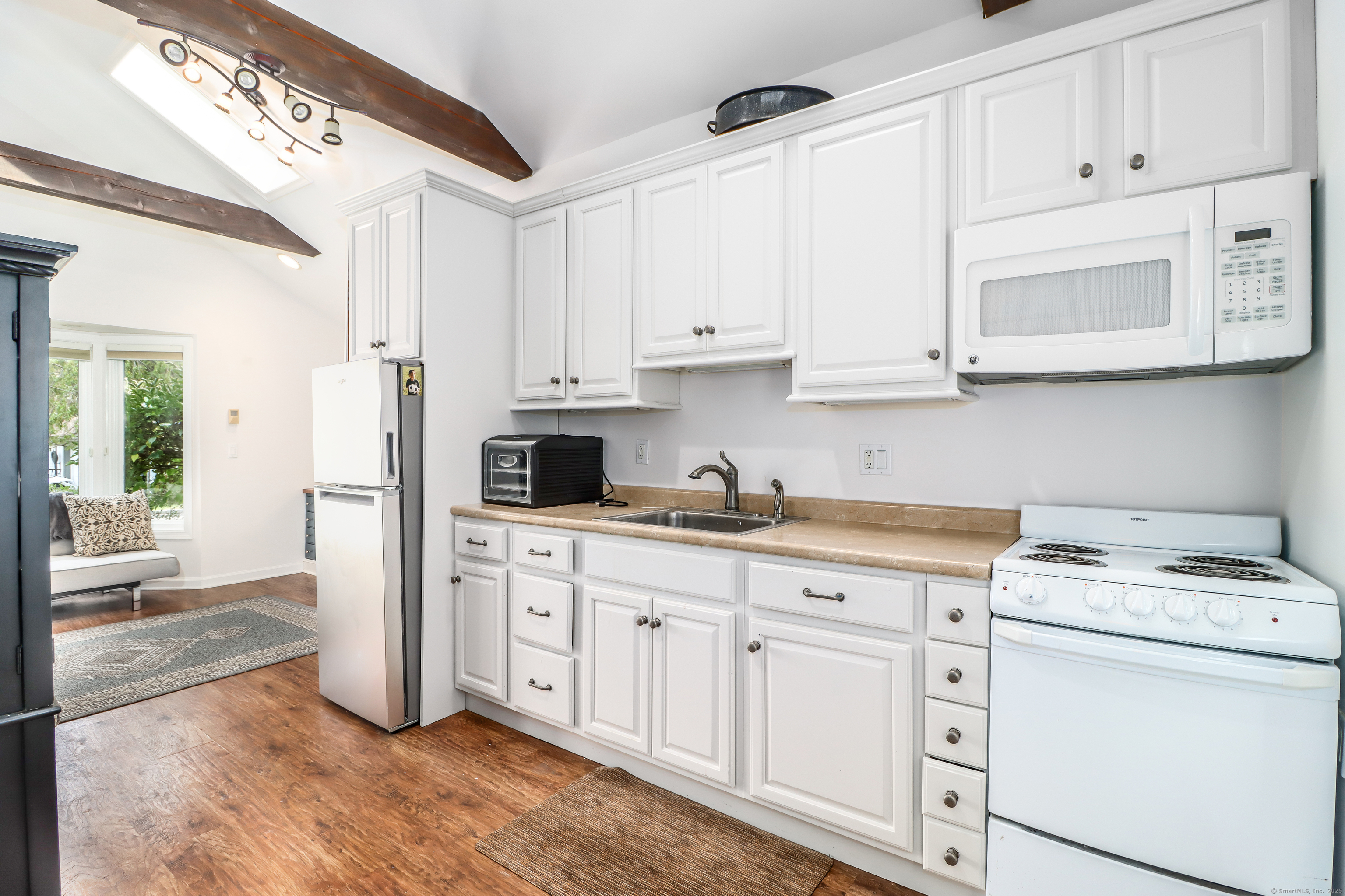 70 Obtuse Hill Road Brookfield, CT 06804 - Photo 31 of 37 a kitchen with white cabinets and white appliances