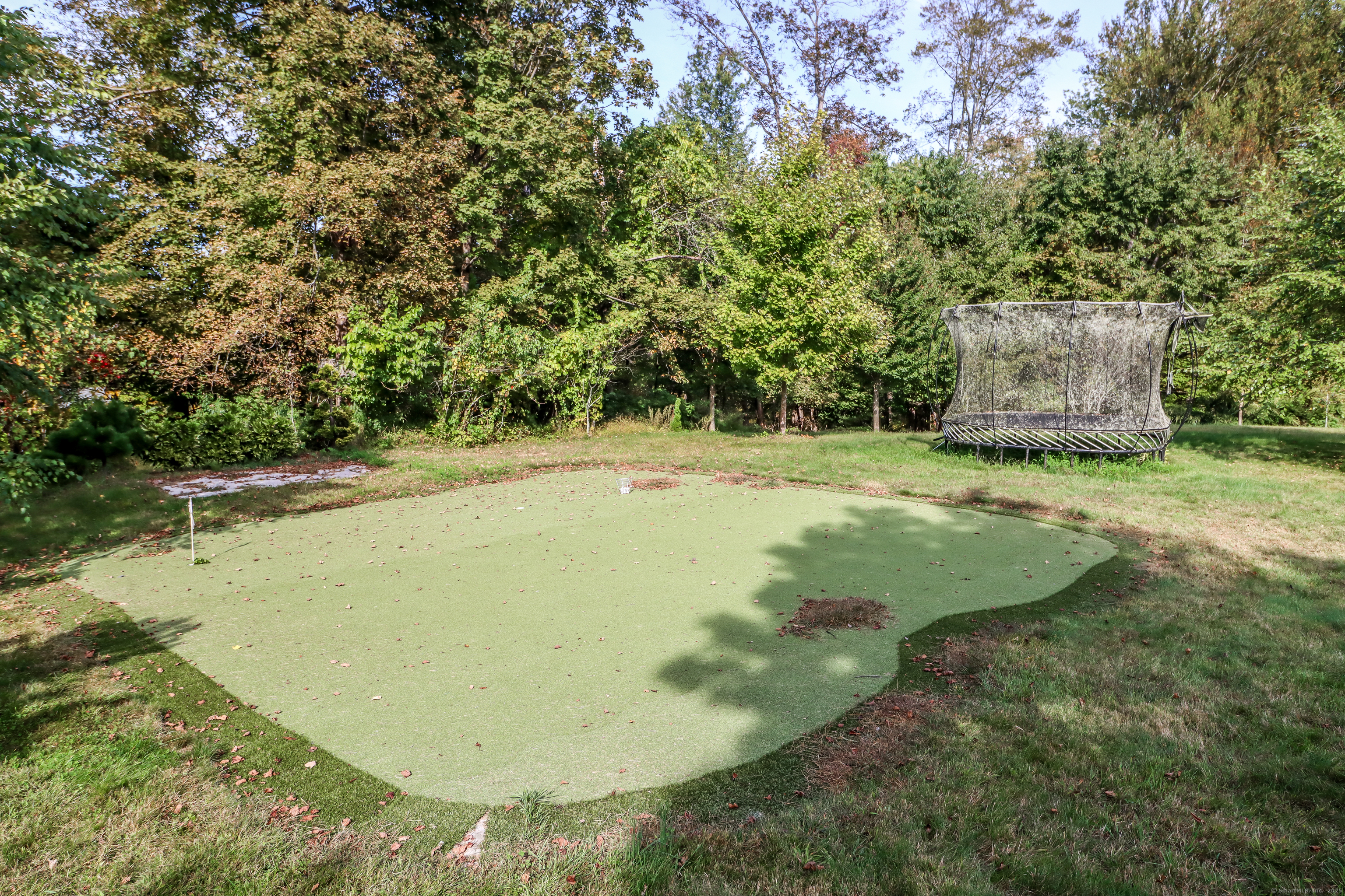 70 Obtuse Hill Road Brookfield, CT 06804 - Photo 34 of 37 a view of a backyard with large trees