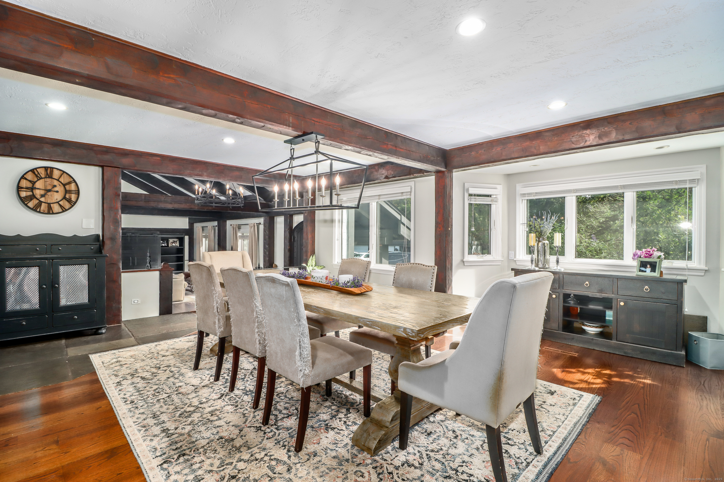 70 Obtuse Hill Road Brookfield, CT 06804 - Photo 9 of 37 a dining room with furniture a rug and wooden floor