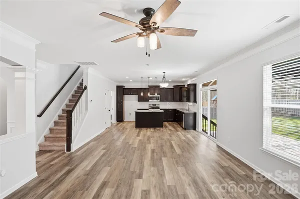 a kitchen with refrigerator and cabinets