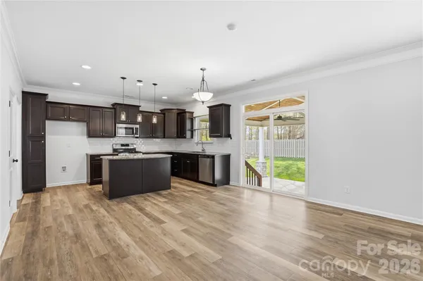 an empty room with a bathroom and mirror