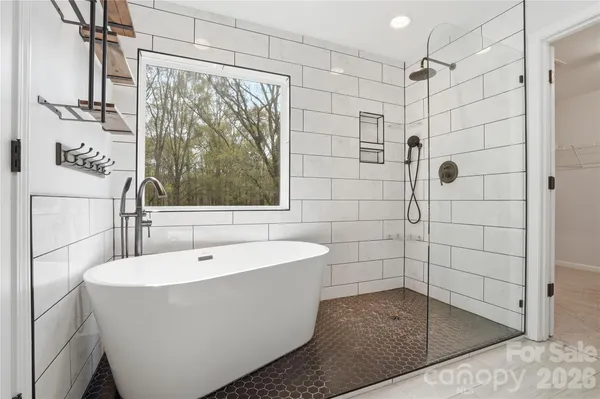 a view of a porch with furniture and garden