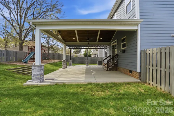 a view of a backyard with a slide