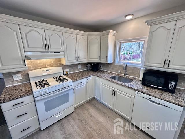 111 Main Street Helmetta, NJ 08828 - Photo 15 of 42 a kitchen with granite countertop white cabinets and white appliances