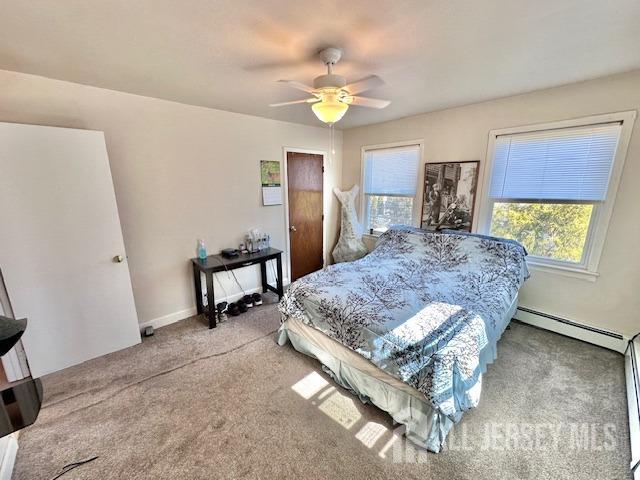 111 Main Street Helmetta, NJ 08828 - Photo 27 of 42 a spacious bedroom with a bed and a chandelier