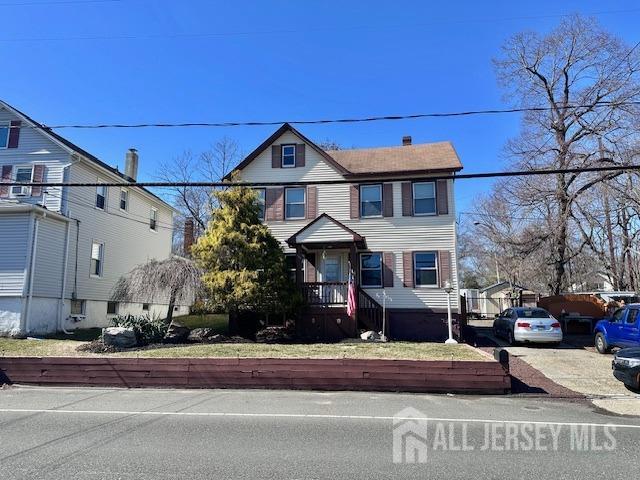 111 Main Street Helmetta, NJ 08828 - Photo 3 of 42 a front view of a house with a yard