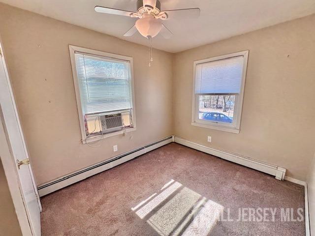 111 Main Street Helmetta, NJ 08828 - Photo 31 of 42 an empty room with windows and fan